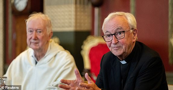 Cardinal Timothy Radcliffe and Cardinal Vincent Nichols make a statement and answer questions during a press conference held at the Throne Room of the Archbishop's House, after the death of Pope Francis was announced by the Vatican, in London, Britain, April, 21, 2025. REUTERS/Chris J. Ratcliffe