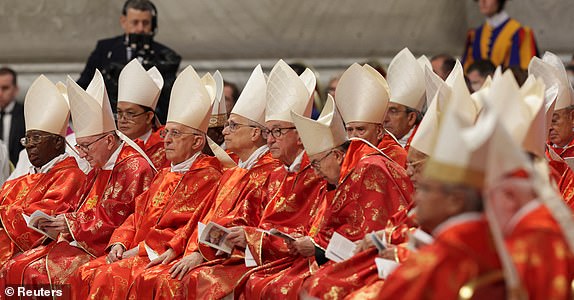 Members of the clergy gather, on the day the Dean of the College of Cardinals, Cardinal Giovanni Battista Re presides over the Holy Mass, celebrated for the election of the new pope, in St. Peter's Basilica, at the Vatican, May 7, 2025. REUTERS/Murad Sezer