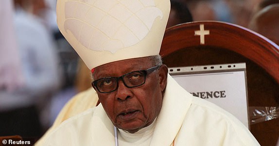 Retired Archbishop of Nairobi Cardinal John Njue attends a requiem Mass of Pope Francis after his death at the Cathedral Basilica of the Holy Family in Nairobi, Kenya, April 25, 2025. REUTERS/Monicah Mwangi
