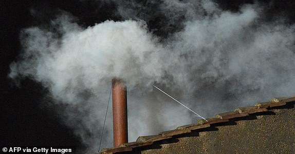 (FILES) White smoke rises from the chimney on the roof of the Sistine Chapel meaning that cardinals elected a new pope on the second day of their secret conclave on  March 13, 2013 at the Vatican. When Catholic cardinals vote in the conclave, they then burn their ballots, sending up black smoke to signal no decision or white smoke to show they have chosen a new pope. The centuries-old tradition of using smoke has changed over time -- as has the technology used. (Photo by Vincenzo PINTO / AFP) (Photo by VINCENZO PINTOVINCENZO PINTO/AFP via Getty Images)
