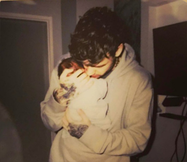 Liam Payne holding his baby.