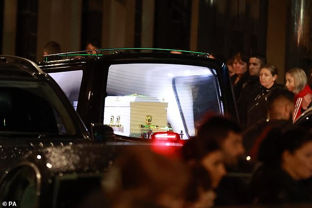 A cortege of motorbikes and cars followed the hearse carrying the white coffin as it moved slowly through the town on August 1, 2023