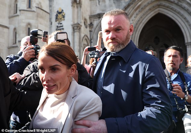 Coleen pictured with her husband Wayne Rooney outside the Royal Courts of Justice in May 2022