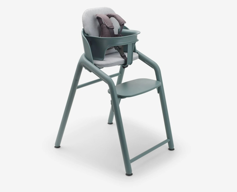 Teal Bugaboo highchair with safety harness.