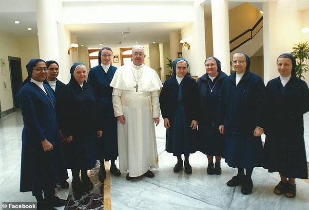 Pope France pictured with the Daughters of Charity nuns from the Domus Sanctae Marthae at Vatican City; the late Pope lived at the guesthouse, and died there on Easter Monday at the age of 88