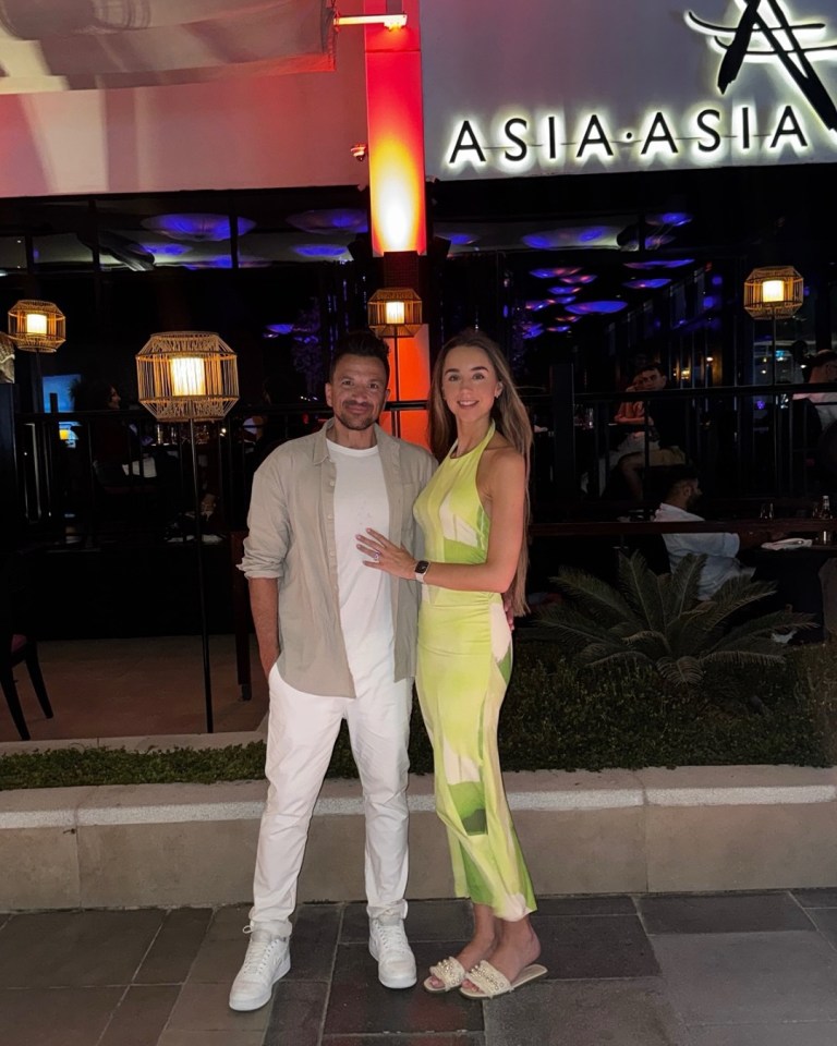 Couple posing in front of Asia Asia restaurant.