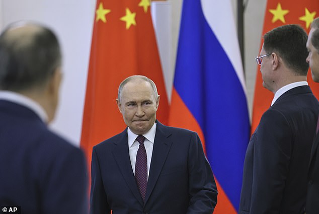 Russian President Vladimir Putin arrives for his talks with China President Xi Jinping at the Kremlin in Moscow, Russia, Thursday, May 8, 2025