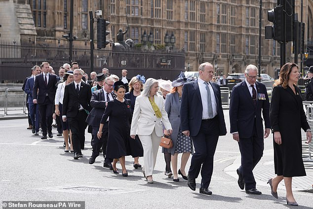 Liberal Democrat party leader Sir Ed Davey (third from right) walks in procession this morning