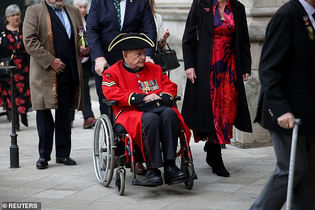 A veteran arrives at Westminster Abbey for today's service of thanksgiving for VE Day