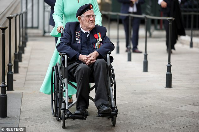 A veteran arrives at Westminster Abbey for today's service of thanksgiving for VE Day