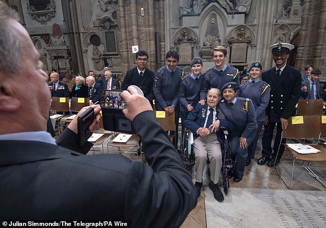 Veteran Harry Winter, who served with the Tiger Squadron and 427 Squadron and spent time as a prisoner of war in Germany, meets young service personnel at Westminster Abbey today