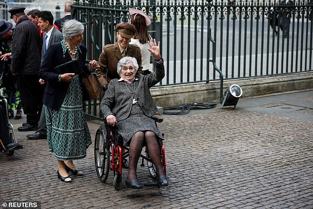 A member of the congregation arrives at Westminster Abbey for the service of thanksgiving