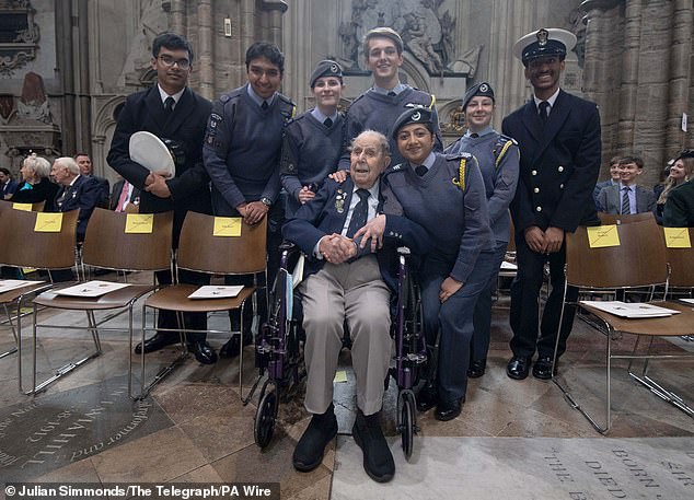 Veteran Harry Winter, who served with the Tiger Squadron and 427 Squadron and spent time as a prisoner of war in Germany, meets young service personnel at Westminster Abbey today