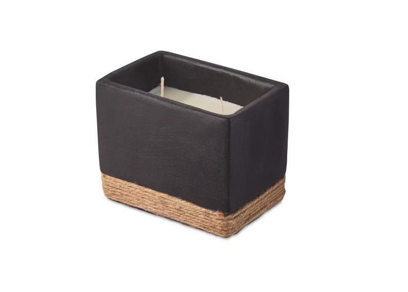 Rectangular candle in dark gray concrete holder with jute trim.