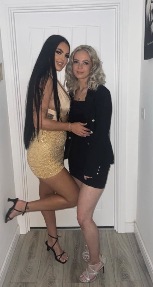 Two sisters posing for a photo.