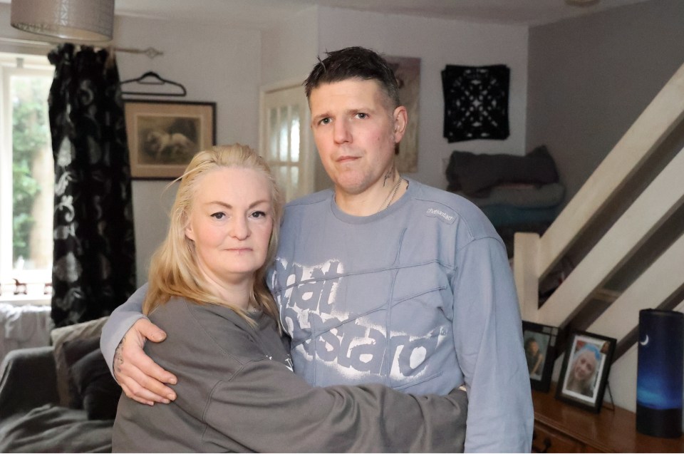 Parents hugging in their home.