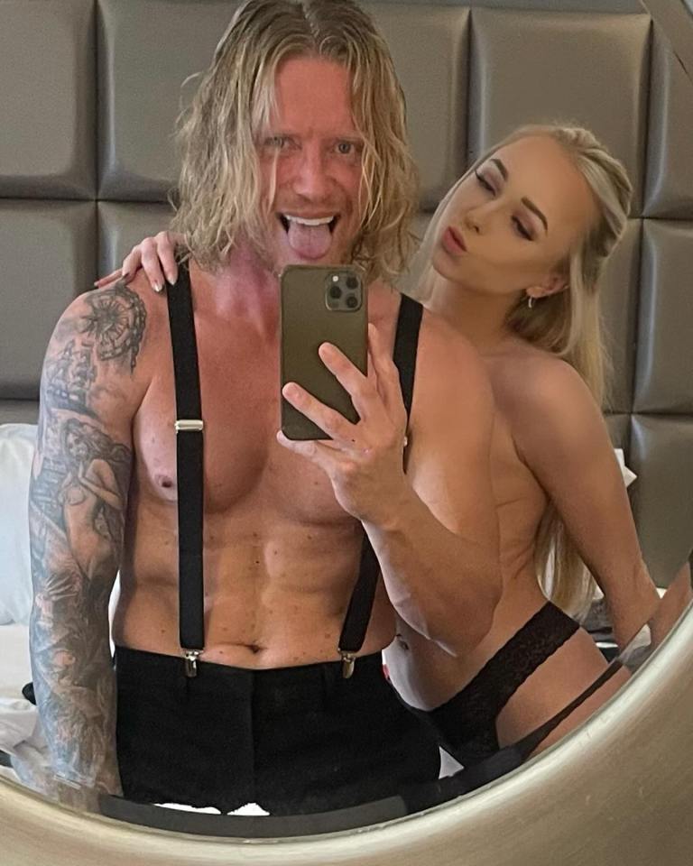 Mirror selfie of a man and woman.