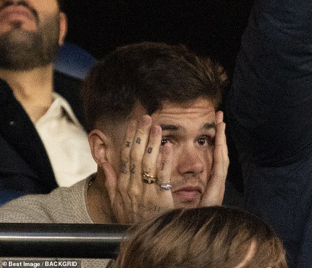 Romeo, who is a huge Arsenal fan despite David being a Man United legend, looked sombre as he watched PSG beat Arsenal 2-1 at the Parc Des Princes stadium on Wednesday
