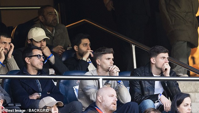 Arsenal fans looked tense as they desperately wanted their team to secure its place in the Champions League final