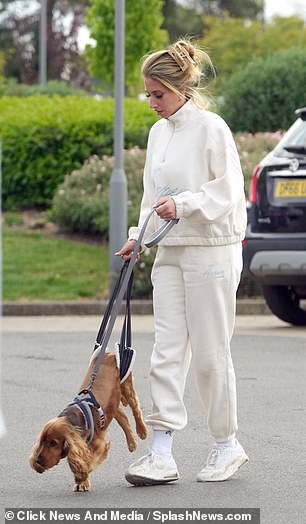 She helped support her dog as they made their way into the clinic