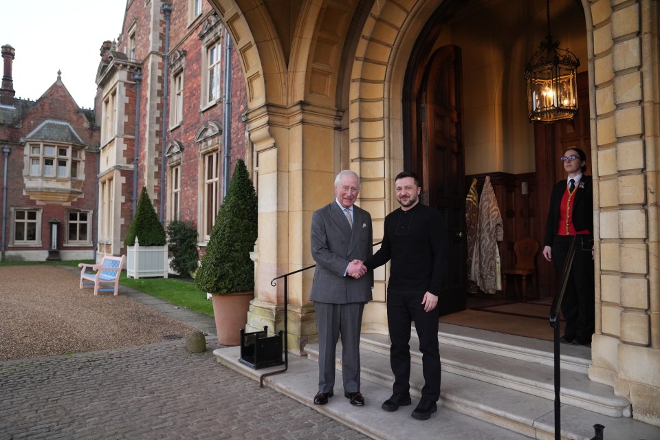 King Charles III shaking hands with Ukrainian President Volodymyr Zelenskyy.