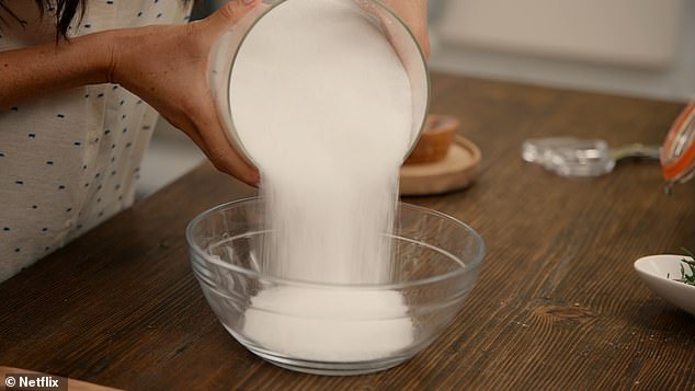 Meghan failed to measure the ingredients of her bath salt recipe, prompting one of her crew members to ask from off-camera, 'Is there a certain amount of salt that I'm dealing with here?'