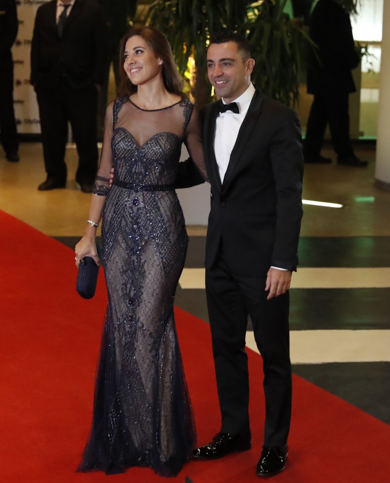 Xavi Hernandez and his wife Nuria Cunillera arriving at a wedding.