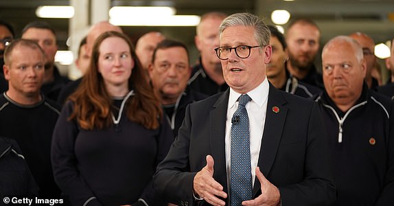 SOLIHULL, ENGLAND - MAY 8: Britain's Prime Minister Keir Starmer speaks to car factory employees during a visit where also spoke to US President Donald Trump on the phone regarding a UK-US trade deal on May 08, 2025 in Solihull, England. U.S. President Donald Trump said it was a "great honour" to strike an agreement on trade and tariffs with the UK and said deals with other countries would soon follow. (Photo by Alberto Pezzali - WPA Pool/Getty Images)