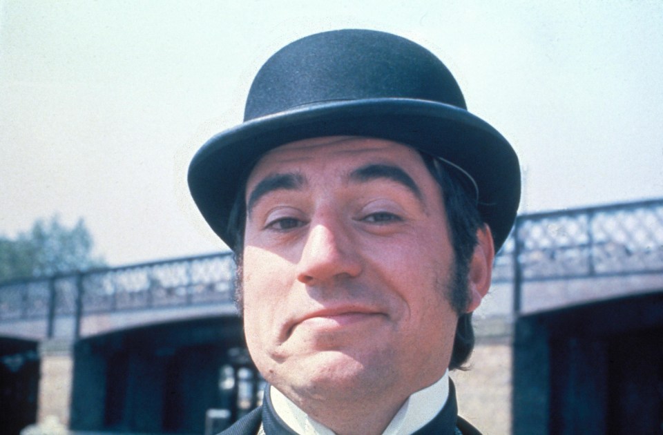 Terry Jones in a bowler hat.