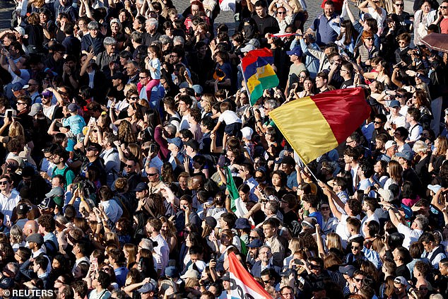 Chants of 'Abbiamo Papa, ole, ole,ole' and 'Viva il Papa' could be heard from the thousands that had rushed towards the square and the flags of dozens of countries were being waved in front of stunningly sunlit St Peter's Basilica