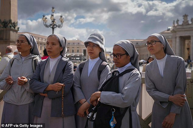 Nuns pray on St Peter's Square on the second day of the conclave