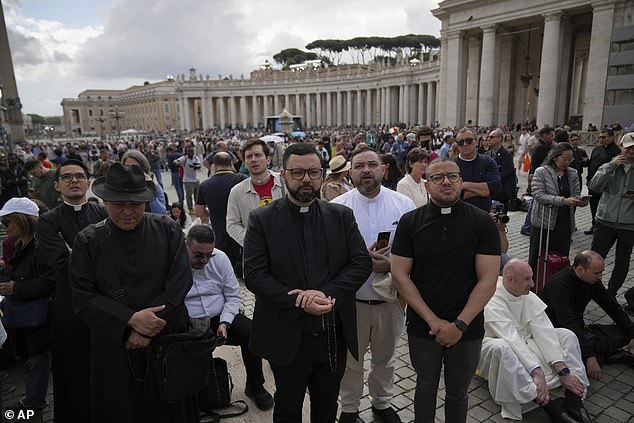 People at St. Peter's square waited to see smoke pour from the chimney of the Sistine Chapel