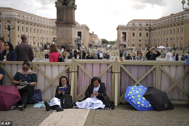 Tens of thousands of faithful patiently waited for the result