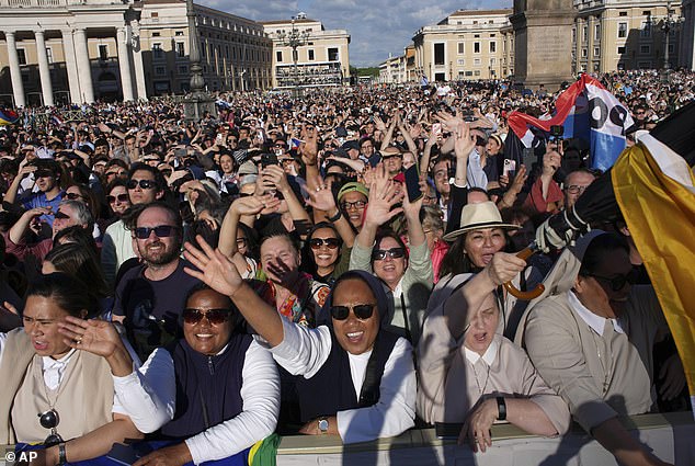 Faithful celebrate after white smoke appeared from the chimney of the Sistine Chapel