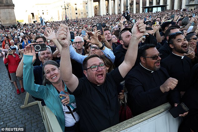 Faithful cheer as newly elected Pope Leo XIV appears on the balcony of St. Peter's Basilica