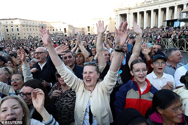 Faithful react to the announcement that US Cardinal Robert Prevost has been elected by the conclave as new pope