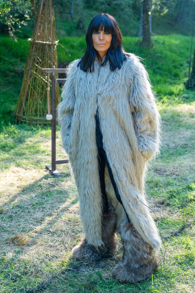 Claudia Winkleman in a long, fluffy coat and furry boots.