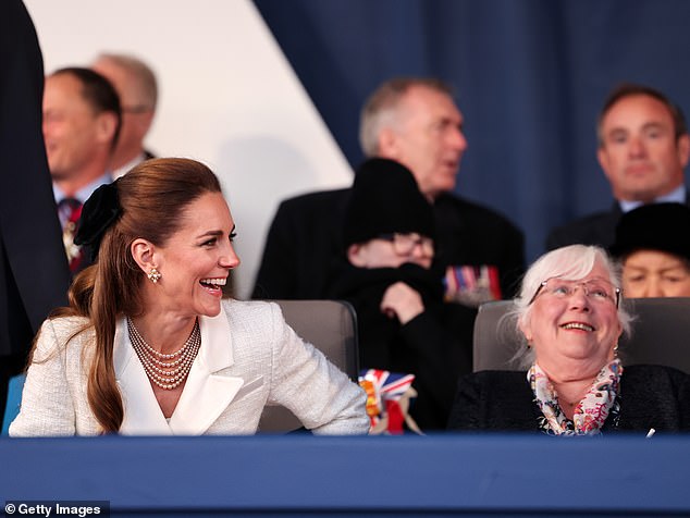 Kate laughed along with other guests as she beamed on arrival at the concert - along with her husband