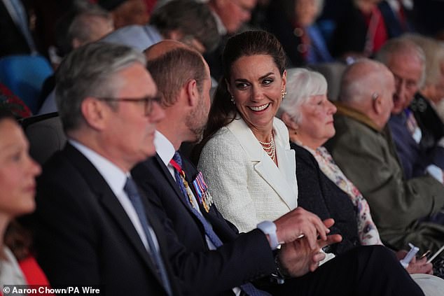 The Princess beamed, sporting an all-white outfit, as she and William sat next to one another this evening