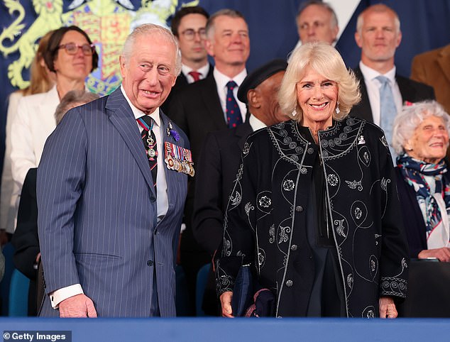 Charles and Camilla were all smiles as they made their way to their seats for the concert this evening