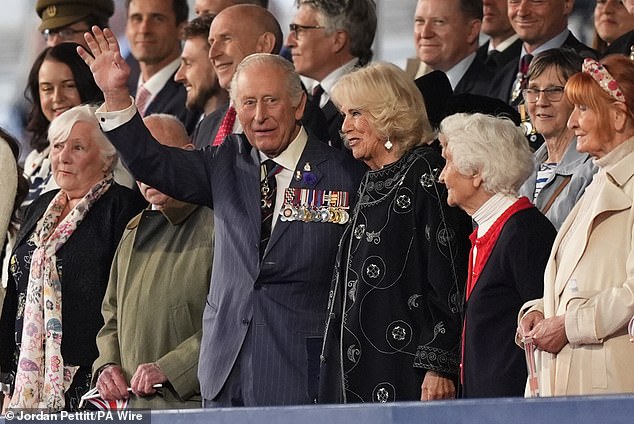 A beaming Charles waved at delighted wellwishers as he made an appearance at the event this evening