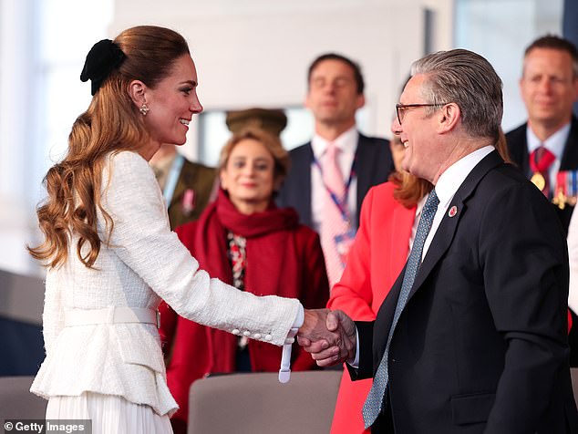 Kate shook hands with Sir Keir, as she made her way to her seat for the moving concert this evening