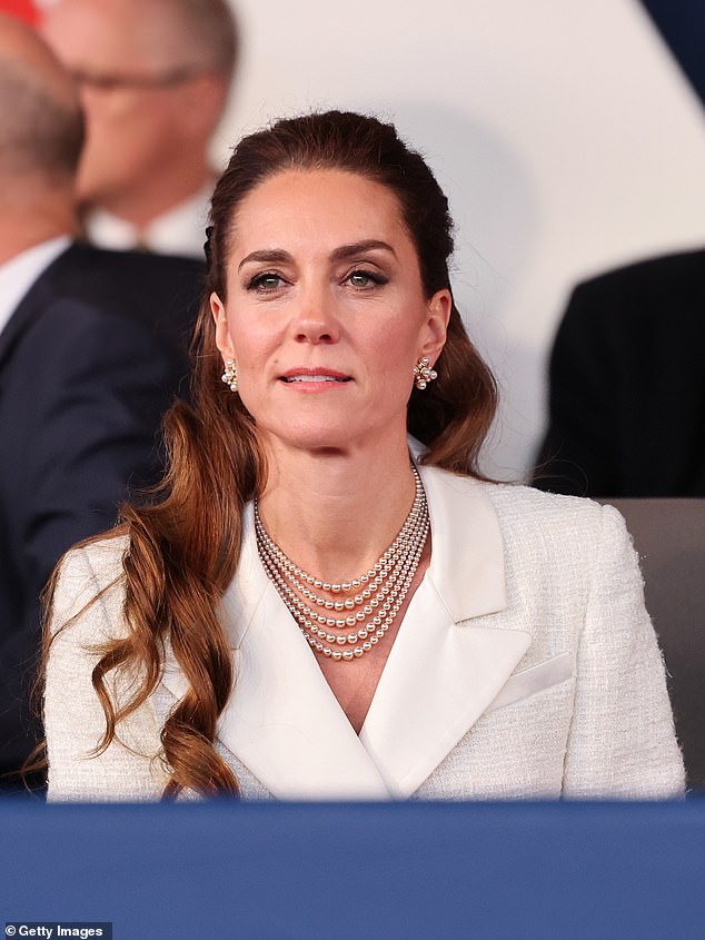 The Princess pulled her tresses back in an updo, adorned with a black bow, for the evening of music