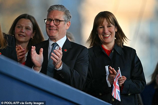 Sir Keir and Rachel, pictured clapped and held onto Union Jack flags as they attended this evening