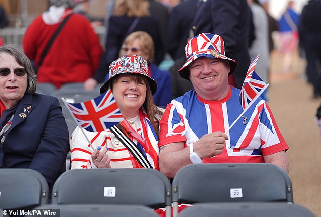 Taking their seats, many in the audience were happy to wave their flags ahead of tonight's concert