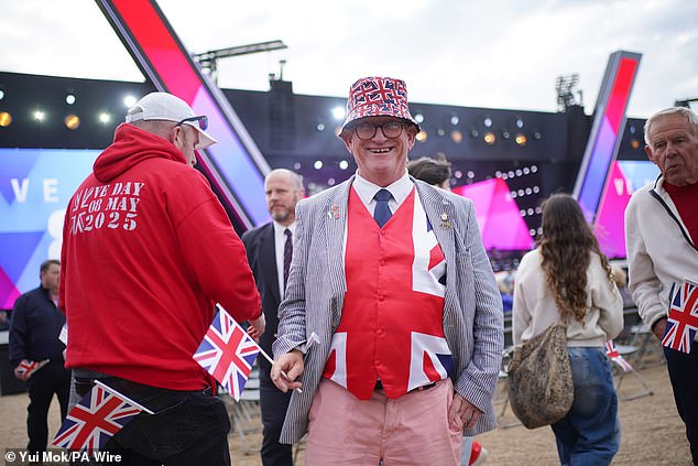 One delighted audience member sported a Union Jack waistcoat for tonight's festivities - as well as a hat
