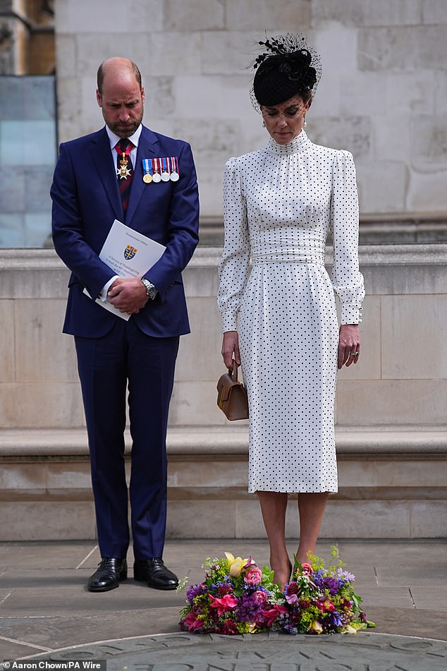 The Prince and Princess of Wales bowed their heads as they paid tribute to people killed in conflict
