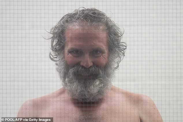 Mississippi man Carwyle did not enter a plea, or speak at all, but intently stared at the courtroom and placed his hands on the glass during the hearing