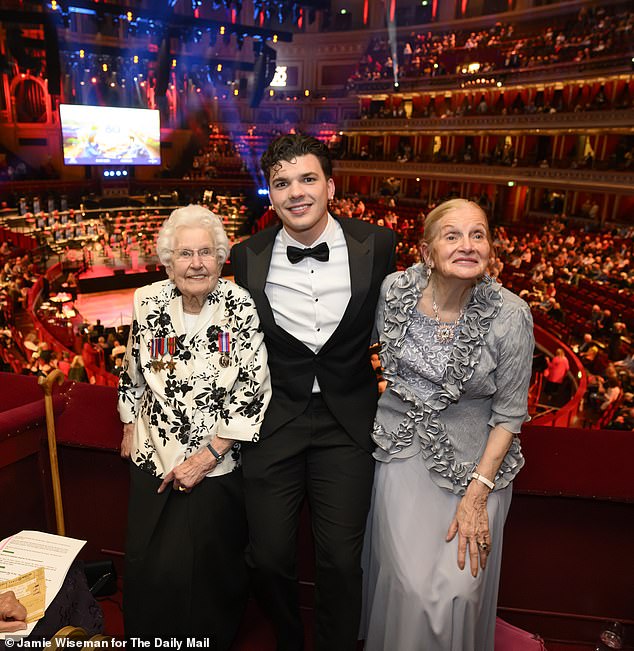 WW2 Evacuee Doreen Simpson (L) and Ruth Barnwell (R) met with Traitors Winner and Army Veteran Harry Clarke (C) at the VE 80th Celebration at the Royal Albert Hall