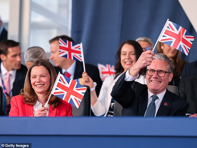 Sir Kier Starmer and his wife Victoria waved flags to celebrate